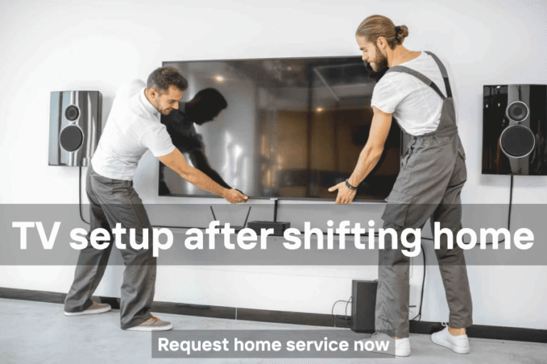 Technician setting up a TV in a new home after relocation