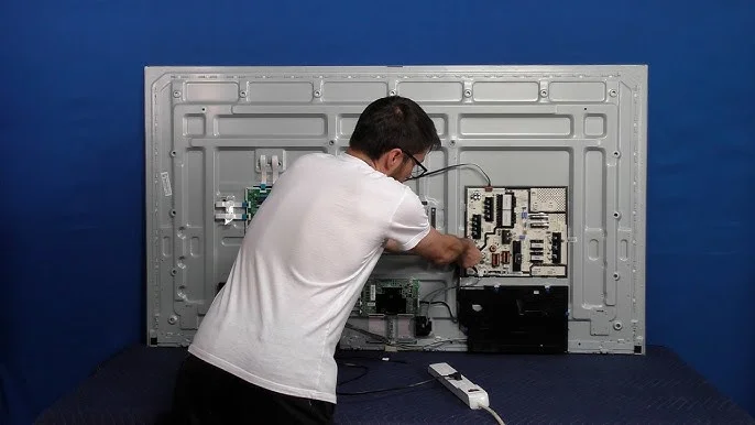 Samsung Smart TV repair service near me — technician fixing Samsung TV at Riyadh Electronics Uttara